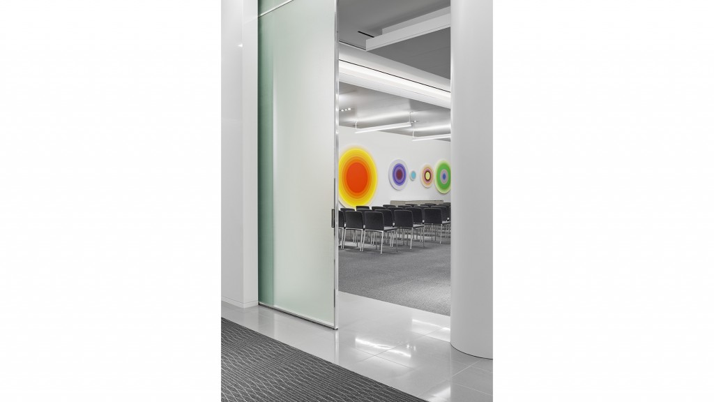 A hallway with chairs and a table.